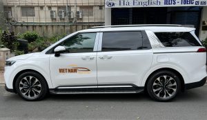 kia carnival white car rental in Ho Chi Minh City